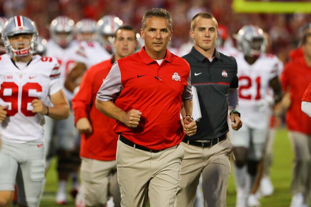 NORMAN, OK - SEPTEMBER 17:  Head coach of the Ohio State Buckeyes Urban Meyer leads the team onto the field prior to the game between Ohio State and Oklahoma at Gaylord Family Oklahoma Memorial Stadium on September 17, 2016 in Norman, Oklahoma.  (Photo by Scott Halleran/Getty Images)