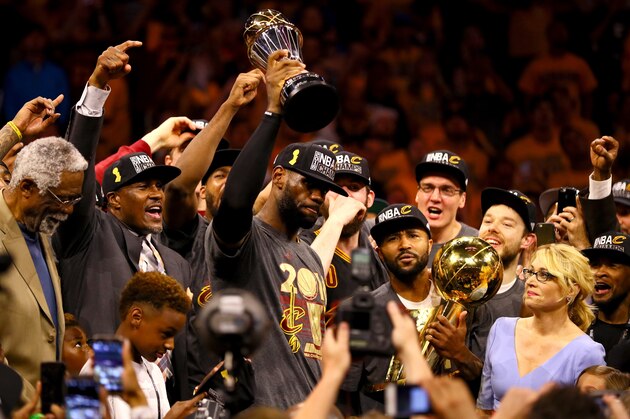 OAKLAND, CA - JUNE 19:  LeBron James #23 of the Cleveland Cavaliers holds the Bill Russell NBA Finals Most Valuable Player Award after defeating the Golden State Warriors 93-89 in Game 7 of the 2016 NBA Finals at ORACLE Arena on June 19, 2016 in Oakland, California. NOTE TO USER: User expressly acknowledges and agrees that, by downloading and or using this photograph, User is consenting to the terms and conditions of the Getty Images License Agreement.  (Photo by Ezra Shaw/Getty Images)