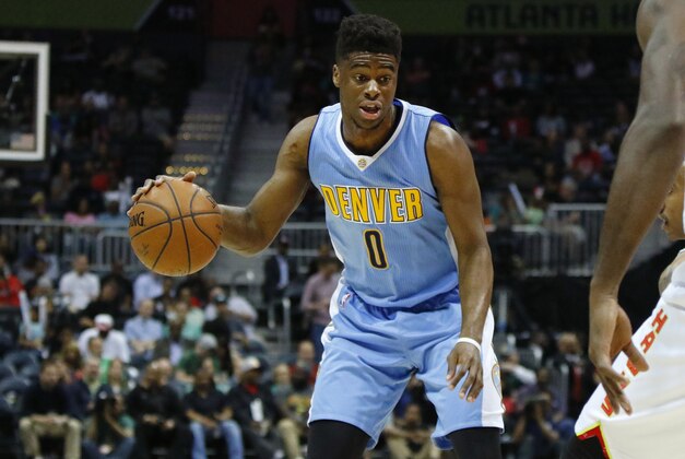 Mar 17, 2016; Atlanta, GA, USA; Denver Nuggets guard Emmanuel Mudiay (0) dribbles against the Atlanta Hawks in the first quarter at Philips Arena. Mandatory Credit: Brett Davis-USA TODAY Sports