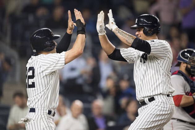 NEW YORK, NY - SEPTEMBER 27:   Gary Sanchez #24 of the New York Yankees celebrates a two-run home run against the Boston Red Sox with Jacoby Ellsbury #22 in the first inning at Yankee Stadium on September 27, 2016  in the Bronx borough of New York City. (Photo by Michael Ivins/Boston Red Sox/Getty Images)
