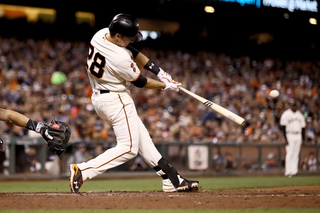 SAN FRANCISCO, CA - SEPTEMBER 27:  Buster Posey #28 of the San Francisco Giants hits a home run in the fifth inning against the Colorado Rockies at AT&T Park on September 27, 2016 in San Francisco, California.  (Photo by Ezra Shaw/Getty Images)