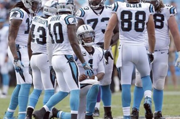 Carolina Panthers' Cam Newton (1) kneels in the huddle as he tries to find a way to score against the Minnesota Vikings during the second half of an NFL football game in Charlotte, N.C., Sunday, Sept. 18, 2016. The Vikings won 22-10. (AP Photo/Bob Leverone)