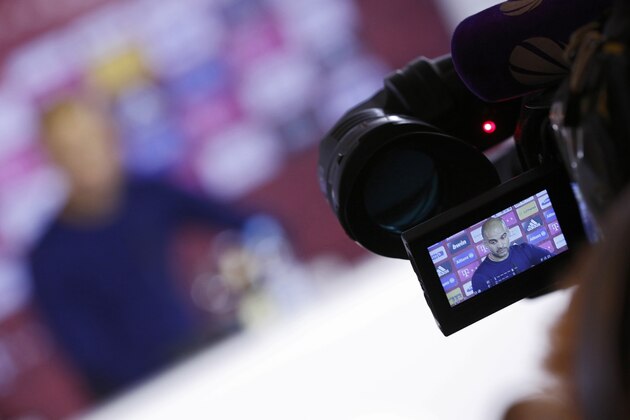MUNICH, GERMANY - MARCH 14:  Heead coach of Munich Pep Guardiola is seen on a camera display during a press conference at the offices of German football club FC Bayern following the announcement by Uli Hoeness that he has resigned as club governing board chairman and will not appeal the three and half year jail sentence handed down by a Munich court the day before on March 14, 2014 in Munich, Germany. A judge found Hoeness guilty of evading taxes totaling at least EUR 27.2 million and declared his pre-emptive attempt at turning himself in to German tax authorities as invalid. Hoeness has been a pillar in German football club history, beginning with his career as a stellar professional player with FC Bayern in the 1970s to his role as FC Bayern club chairman, during which the Bundesliga team has been among the most successful in Germany.  (Photo by Philipp Guelland/Getty Images)