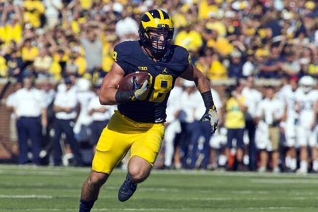 Michigan tight end Jake Butt (88) rushes after a reception in the first quarter of an NCAA college football game against Penn State at Michigan Stadium in Ann Arbor, Mich., Saturday, Sept. 24, 2016. (AP Photo/Tony Ding)
