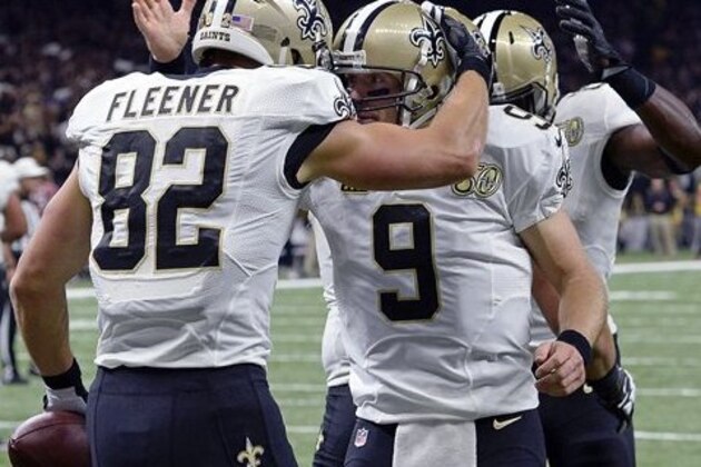 New Orleans Saints tight end Coby Fleener (82) celebrates his touchdown reception with quarterback Drew Brees (9) in the first half of an NFL football game against the Atlanta Falcons in New Orleans, Monday, Sept. 26, 2016. (AP Photo/Bill Feig)