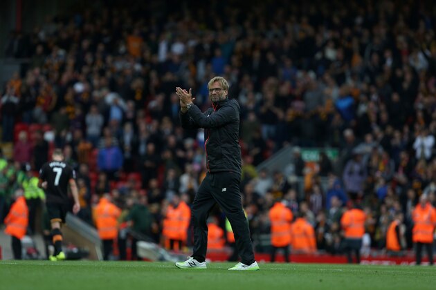 Liverpool's German manager Jurgen Klopp congratulates his players following the English Premier League football match between Liverpool and Hull City at Anfield in Liverpool, north west England on September 24, 2016. / AFP / Geoff CADDICK / RESTRICTED TO EDITORIAL USE. No use with unauthorized audio, video, data, fixture lists, club/league logos or 'live' services. Online in-match use limited to 75 images, no video emulation. No use in betting, games or single club/league/player publications.  /         (Photo credit should read GEOFF CADDICK/AFP/Getty Images)
