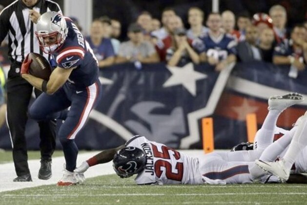 New England Patriots wide receiver Julian Edelman (11) runs away from Houston Texans cornerback Kareem Jackson (25) during the first half of an NFL football game Thursday, Sept. 22, 2016, in Foxborough, Mass. (AP Photo/Elise Amendola)