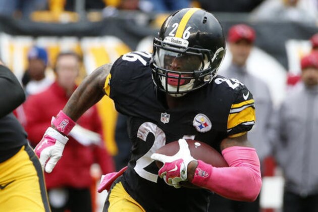 FILE - In this Oct. 18, 2015, file photo, Pittsburgh Steelers running back Le'Veon Bell (26) carries the ball during an NFL football game against the Arizona Cardinals in Pittsburgh. Bell returns to the lineup for the Steelers on Sunday against Kansas City, and not a moment too soon. The Steelers (2-1) were throttled by Philadelphia 34-3 last Sunday, the franchise’s worst loss in 27 years.  (AP Photo/Gene J. Puskar, File)
