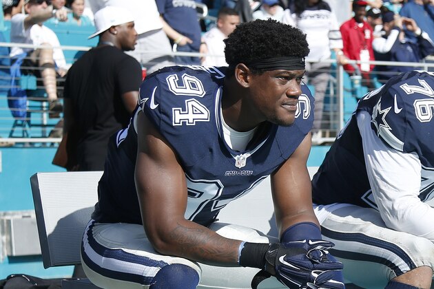 MIAMI GARDENS, FL - NOVEMBER 22: Randy Gregory #94 and Greg Hardy #76 of the Dallas Cowboys sit on the bench against the Miami Dolphins during the game at Sun Life Stadium on November 22, 2015 in Miami Gardens, Florida. Dallas defeated Miami 24-14. (Photo by Joe Robbins/Getty Images)