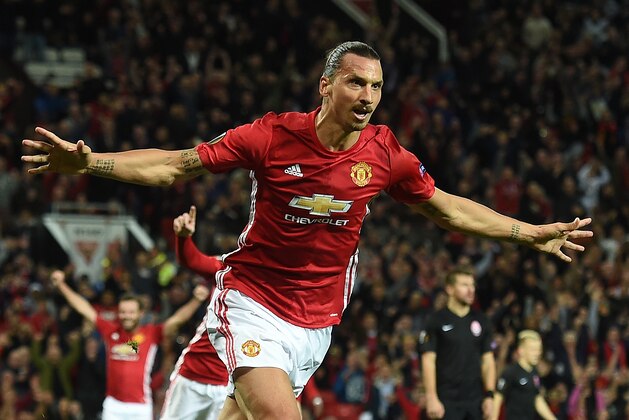 Manchester United's Swedish striker Zlatan Ibrahimovic (C) celebrates scoring his team's first goal during the UEFA Europa League group A football match between Manchester United and Zorya Luhansk at Old Trafford stadium in Manchester, north-west England, on September 29, 2016. / AFP / PAUL ELLIS        (Photo credit should read PAUL ELLIS/AFP/Getty Images)