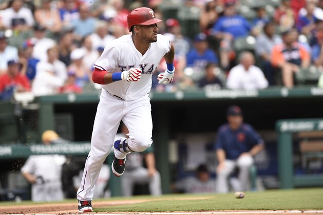 ARLINGTON, TX - AUGUST 14:  Ian Desmond #20 of the Texas Rangers runs to first base after hitting the ball in the game against the Detroit Tigers at Globe Life Park in Arlington on August 14, 2016 in Arlington, Texas. The Detroit Tigers defeated the Texas Rangers 7-0. (Photo by John Williamson/MLB Photos via Getty Images)