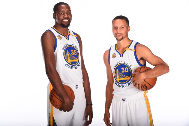 OAKLAND, CA - SEPTEMBER 26:  Kevin Durant #35 and Stephen Curry #30 of the Golden State Warriors pose for a portrait during NBA Media Day at Oracle Arena in Oakland, California on September 26, 2016. NOTE TO USER: User expressly acknowledges and agrees that, by downloading and or using this photograph, user is consenting to the terms and conditions of Getty Images License Agreement. Mandatory Copyright Notice: Copyright 2016 NBAE (Photo by Noah Graham/NBAE via Getty Images)