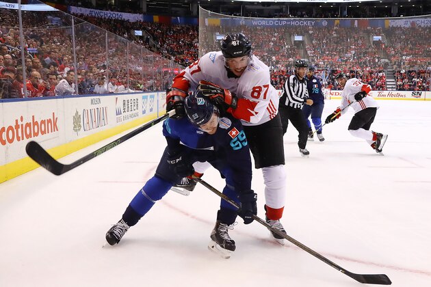 TORONTO, ON - SEPTEMBER 29: Roman Josi #59 of Team Europe is checked by Sidney Crosby #87 of Team Canada during the second period during Game Two of the World Cup of Hockey final series at the Air Canada Centre on September 29, 2016 in Toronto, Canada.  (Photo by Bruce Bennett/Getty Images)