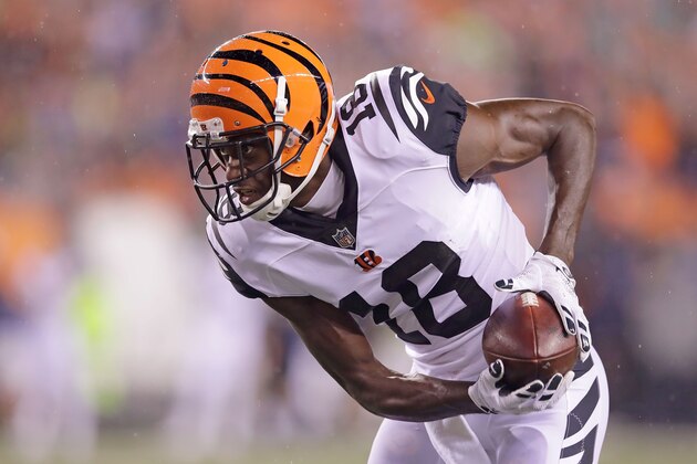 CINCINNATI, OH - SEPTEMBER 29:  A.J. Green #18 of the Cincinnati Bengals carries the ball during the first quarter of the game against the Miami Dolphins at Paul Brown Stadium on September 29, 2016 in Cincinnati, Ohio. (Photo by Andy Lyons/Getty Images)