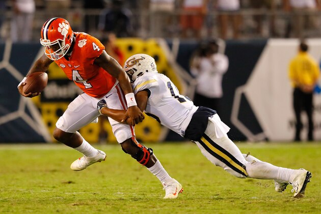 ATLANTA, GA - SEPTEMBER 22:  Deshaun Watson #4 of the Clemson Tigers attempts to break a tackle by A.J. Gray #15 of the Georgia Tech Yellow Jackets at Bobby Dodd Stadium on September 22, 2016 in Atlanta, Georgia.  (Photo by Kevin C. Cox/Getty Images)
