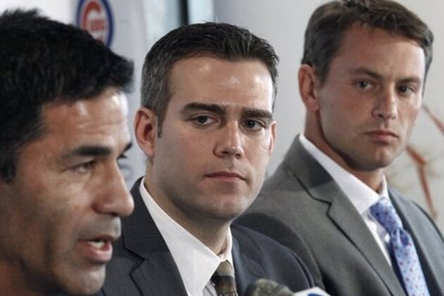 Chicago Cubs president of baseball operations Theo Epstein, center, and new general manager Jed Hoyer, right, listen to new head of scouting and player development Jason McLeod, during a news conference Tuesday, Nov. 1, 2011, in Chicago. Hoyer and McLeod are reuniting with Epstein, who also worked with the pair in Boston. (AP Photo/Charles Rex Arbogast)