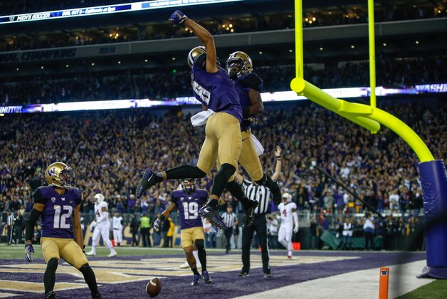 SEATTLE, WA - SEPTEMBER 30:  Wide receiver John Ross #1 of the Washington Huskies is congratulated by wide receiver Dante Pettis #8 after scoring a touchdown against the Stanford Cardinal in the second quarter on September 30, 2016 at Husky Stadium in Seattle, Washington.  (Photo by Otto Greule Jr/Getty Images)