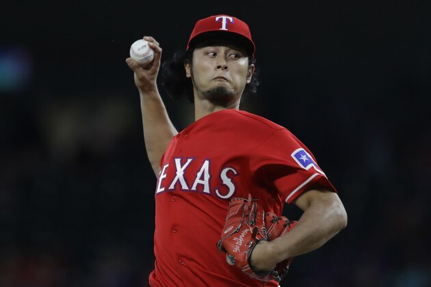 ARLINGTON, TX - SEPTEMBER 30:  Yu Darvish #11 of the Texas Rangers throws against the Tampa Bay Rays in the first inning at Globe Life Park in Arlington on September 30, 2016 in Arlington, Texas.  (Photo by Ronald Martinez/Getty Images)