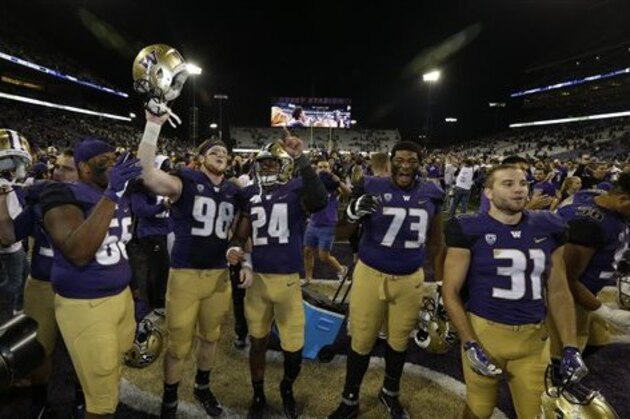 Washington players celebrate after they beat Stanford 44-6 in an NCAA college football game, Friday, Sept. 30, 2016, in Seattle. (AP Photo/Ted S. Warren)