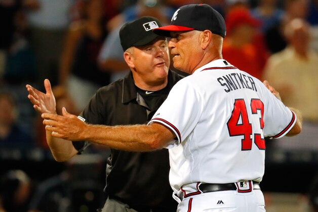 ATLANTA, GA - JUNE 23: Brian Snitker #43 of the Atlanta Braves argues with third base umpire Mike Everitt #57 prior to being ejected from arguing the call on the video review initiated from Emilio Bonifacio #64 being called out at homeplate against Travis d'Arnaud #7 of the New York Mets to end the seventh inning at Turner Field on June 23, 2016 in Atlanta, Georgia. (Photo by Kevin C. Cox/Getty Images) ATLANTA, GA - JUNE 23: Brian Snitker #43 of the Atlanta Braves argues with third base umpire Mike Everitt #57 prior to being ejected from arguing the call on the video review initiated from Emilio Bonifacio #64 being called out at homeplate against Travis d'Arnaud #7 of the New York Mets to end the seventh inning at Turner Field on June 23, 2016 in Atlanta, Georgia. (Photo by Kevin C. Cox/Getty Images)