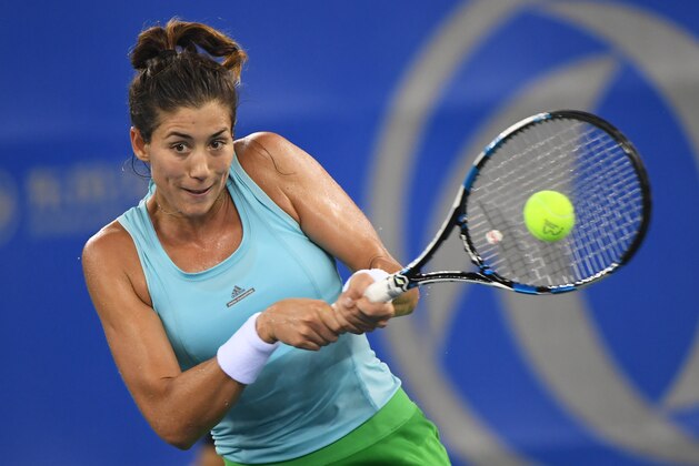 Garbine Muguruza of Spain hits a return during her second round match against Jelena Jankovic of Serbia at the WTA Wuhan Open in Wuhan, in China's central Hubei province on September 27, 2016. / AFP / GREG BAKER        (Photo credit should read GREG BAKER/AFP/Getty Images)