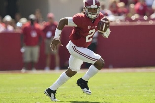 Alabama quarterback Jalen Hurts runs the ball during an NCAA college football game against Kent State, Saturday, Sept. 24, 2016, in Tuscaloosa, Ala. (AP Photo/Brynn Anderson)
