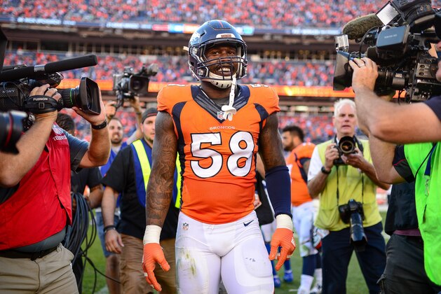 DENVER, CO - SEPTEMBER 18:  Outside linebacker Von Miller #58 of the Denver Broncos smiles as he is surrounded by media after a game against the Indianapolis Colts at Sports Authority Field at Mile High on September 18, 2016 in Denver, Colorado. (Photo by Dustin Bradford/Getty Images)