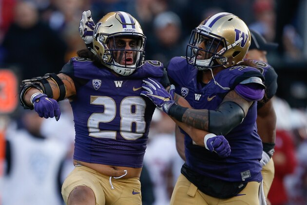 SEATTLE, WA - SEPTEMBER 30:  Linebacker Psalm Wooching #28 of the Washington Huskies celebrates with linebacker Joe Mathis #5 after sacking quarterback Ryan Burns of the Stanford Cardinal on September 30, 2016 at Husky Stadium in Seattle, Washington. The Huskies defeated the Cardinal 44-6.  (Photo by Otto Greule Jr/Getty Images)