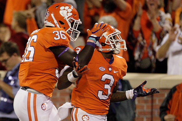 CLEMSON, SC - OCTOBER 01: Artavis Scott #3 of the Clemson Tigers is congratulated by his teammate Judah Davis #36 during the fourth quarter against the Louisville Cardinals at Memorial Stadium on October 1, 2016 in Clemson, South Carolina.  (Photo by Tyler Smith/Getty Images)