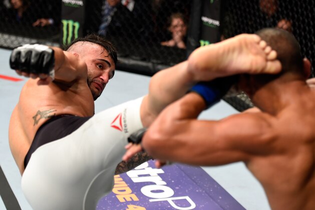 PORTLAND, OR - OCTOBER 01:  (L-R) John Lineker of Brazil kicks John Dodson in their bantamweight bout during the UFC Fight Night event at the Moda Center on October 1, 2016 in Portland, Oregon. (Photo by Josh Hedges/Zuffa LLC/Zuffa LLC via Getty Images)