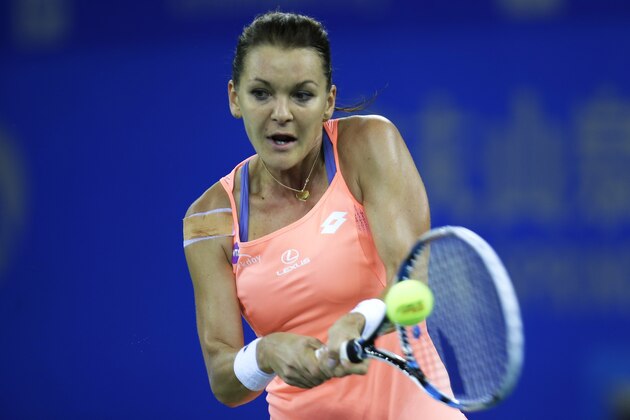 WUHAN, CHINA - SEPTEMBER 29:  Agnieszka Radwanska of Poland returns a shot during the match against Svetlana Kuznetsova of Russia on Day 5 of the 2016 Dongfeng Motor Wuhan Open at the Optics Valley International Tennis Center on September 29, 2016 in Wuhan, China.  (Photo by Wang He/Getty Images)