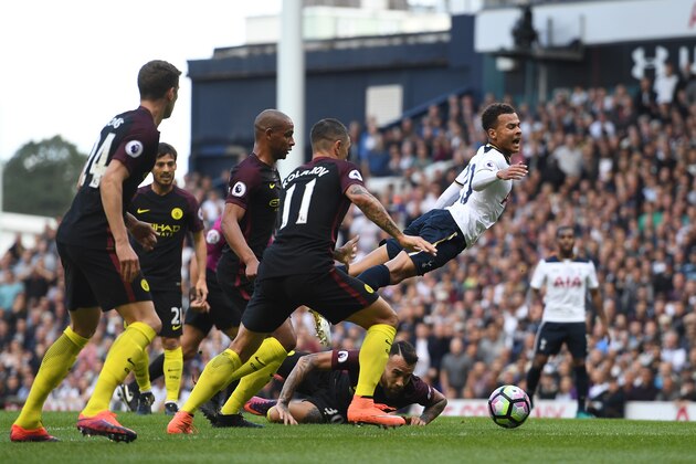 LONDON, ENGLAND - OCTOBER 02: Dele Alli of Tottenham Hotspur is fouled during the Premier League match between Tottenham Hotspur and Manchester City at White Hart Lane on October 2, 2016 in London, England.  (Photo by Shaun Botterill/Getty Images)