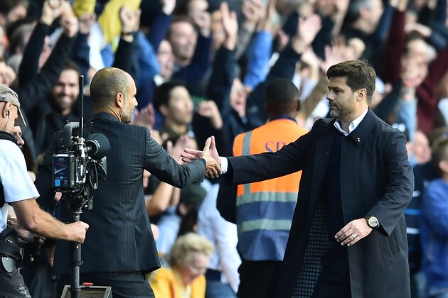 Tottenham Hotspur's Argentinian head coach Mauricio Pochettino (R) shakes hands with Manchester City's Spanish manager Pep Guardiola after the English Premier League football match between Tottenham Hotspur and Manchester City at White Hart Lane in London, on October 2, 2016.
Tottenham won the game 2-0, Manchester City's first defeat of the season. / AFP / Glyn KIRK / RESTRICTED TO EDITORIAL USE. No use with unauthorized audio, video, data, fixture lists, club/league logos or 'live' services. Online in-match use limited to 75 images, no video emulation. No use in betting, games or single club/league/player publications.  /         (Photo credit should read GLYN KIRK/AFP/Getty Images)