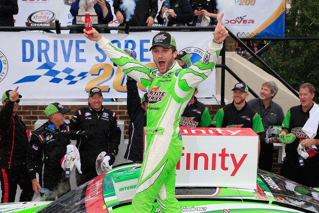DOVER, DE - OCTOBER 02:  Daniel Suarez, driver of the #19 Interstate Batteries Toyota, celebrates in Victory Lane after winning the NASCAR XFINITY Series Drive Sober 200 at Dover International Speedway on October 2, 2016 in Dover, Delaware.  (Photo by Chris Trotman/Getty Images)