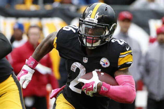FILE - In this Oct. 18, 2015, file photo, Pittsburgh Steelers running back Le'Veon Bell (26) carries the ball during an NFL football game against the Arizona Cardinals in Pittsburgh. Bell returns to the lineup for the Steelers on Sunday against Kansas City, and not a moment too soon. The Steelers (2-1) were throttled by Philadelphia 34-3 last Sunday, the franchise’s worst loss in 27 years.  (AP Photo/Gene J. Puskar, File)