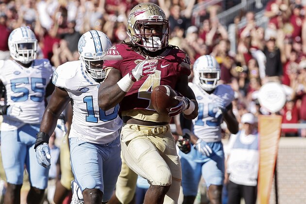 TALLAHASSEE, FL - OCTOBER 1: Runningback Dalvin Cook #4 of the Florida State Seminoles runs in for a touchdown during the game against the North Carolina Tar Heels at Doak Campbell Stadium on Bobby Bowden Field on October 1, 2016 in Tallahassee, Florida. North Carolina upset the 12th ranked Florida State 37 to 35. (Photo by Don Juan Moore/Getty Images)