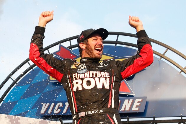 DOVER, DE - OCTOBER 02:  Martin Truex Jr., driver of the #78 Furniture Row/Denver Mattress Toyota, celebrates in Victory Lane after winning the NASCAR Sprint Cup Series Citizen Solider 400 at Dover International Speedway on October 2, 2016 in Dover, Delaware.  (Photo by Matt Sullivan/Getty Images)