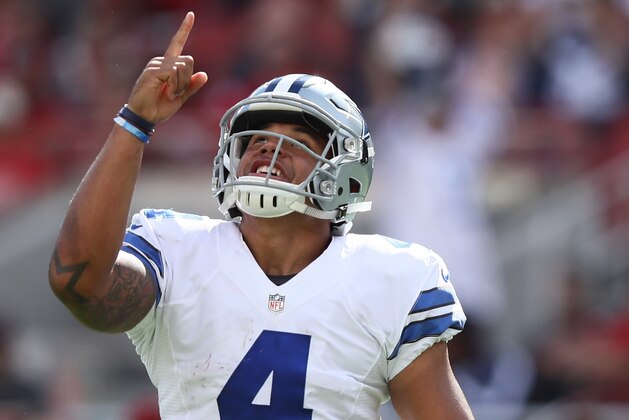 SANTA CLARA, CA - OCTOBER 02:   Dak Prescott #4 of the Dallas Cowboys celebrates after a rushing touchdown by running back Ezekiel Elliott (not pictured) against the San Francisco 49ers at Levi's Stadium on October 2, 2016 in Santa Clara, California. (Photo by Ezra Shaw/Getty Images)