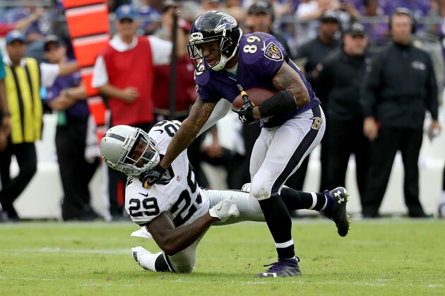 BALTIMORE, MD - OCTOBER 2:  Steve Smith Sr. #89 of the Baltimore Ravens fends off a tackle attempt by David Amerson #29 of the Oakland Raiders in the fourth quarter at M&T Bank Stadium on October 2, 2016 in Baltimore, Maryland. (Photo by Rob Carr/Getty Images)