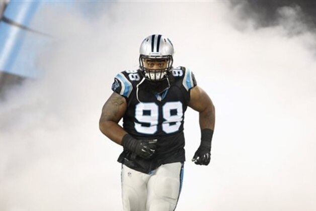 Carolina Panthers' Kawann Short (99) during introductions before an NFL football game against the Philadelphia Eagles in Charlotte, N.C., Sunday, Oct. 25, 2015. The Panthers won 27-16. (AP Photo/Bob Leverone)