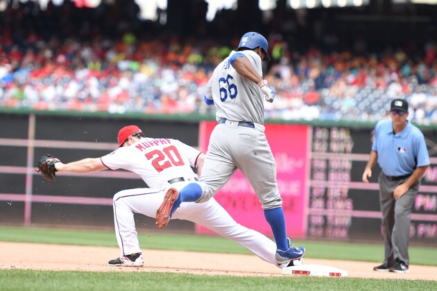 WASHINGTON, DC - JULY 21:  Yasiel Puig #66 of the Los Angeles Dodgers can not beat the throw to Daniel Murphy #20 of the Washington Nationals during a baseball game at Nationals Park on July 21, 2016 in Washington, DC.  (Photo by Mitchell Layton/Getty Images)