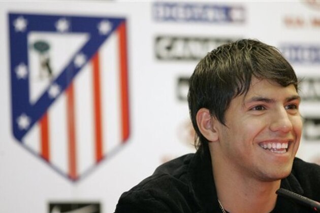 Argentine forward Sergio Aguero smiles during a press conference the day of his official presentation as an Atletico Madrid soccer team player in the Vicente Calderon stadium in Madrid, Monday, June 5, 2006. (AP Photo/Bernat Armangue)