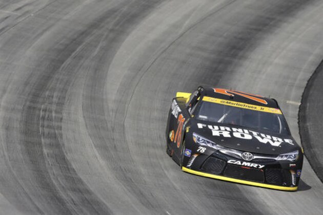 Martin Truex Jr., (78) drives during a NASCAR Sprint Cup Series auto race, Sunday, Oct. 2, 2016, at Dover International Speedway in Dover, Del. (AP Photo/Mel Evans)