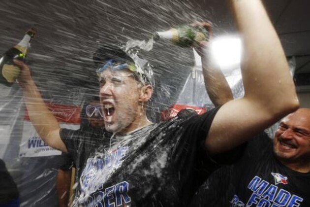 The Toronto Blue Jays Aaron Sanchez celebrates after the Blue Jays clinched a wild-card playoff spot by defeating the Boston Red Sox 2-1 during a baseball game in Boston, Sunday, Oct. 2, 2016. (AP Photo/Michael Dwyer)