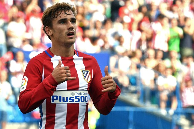 Atletico Madrid's French forward Antoine Griezmann celebrates after scoring during the Spanish league football match Club Atletico de Madrid vs Real Sporting de Gijon at the Vicente Calderon stadium in Madrid on September 17, 2016. / AFP / GERARD JULIEN        (Photo credit should read GERARD JULIEN/AFP/Getty Images)