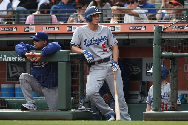 SAN FRANCISCO, CA - OCTOBER 2:  Corey Seager #5 of the Los Angeles Dodgers waits in the dugout for his next at bat alongside his manager Dave Roberts #30 during the game against the San Francisco Giants at AT&T Park on Sunday, October 2, 2016 in San Francisco, California. (Photo by Brad Mangin/MLB Photos via Getty Images)