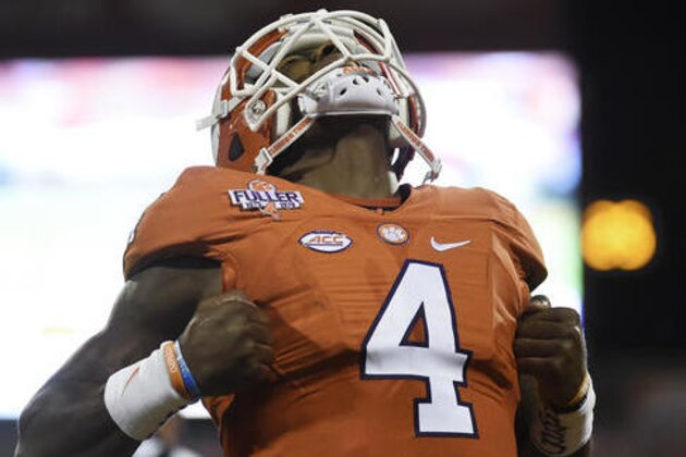 Clemson quarterback Deshaun Watson reacts after throwing a touchdown pass during the first half of an NCAA college football game against Louisville on Saturday, Oct. 1, 2016, in Clemson, S.C. (AP Photo/Rainier Ehrhardt)