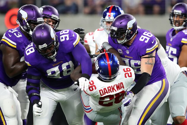 MINNEAPOLIS, MN - OCTOBER 3: Linval Joseph #98 and Brian Robison #96 of the Minnesota Vikings tackle ball carrier Orleans Darkwa #26 of the New York Giants in the first half of the game on October 3, 2016 at US Bank Stadium in Minneapolis, Minnesota. (Photo by Adam Bettcher/Getty Images)