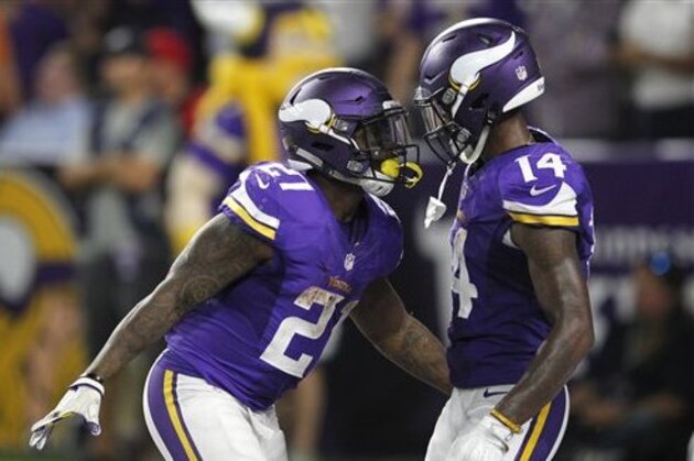 Minnesota Vikings running back Jerick McKinnon, left, celebrates with teammate Stefon Diggs, right, after scoring on a 4-yard touchdown run during the second half of an NFL football game against the New York Giants Monday, Oct. 3, 2016, in Minneapolis. (AP Photo/Andy Clayton-King)