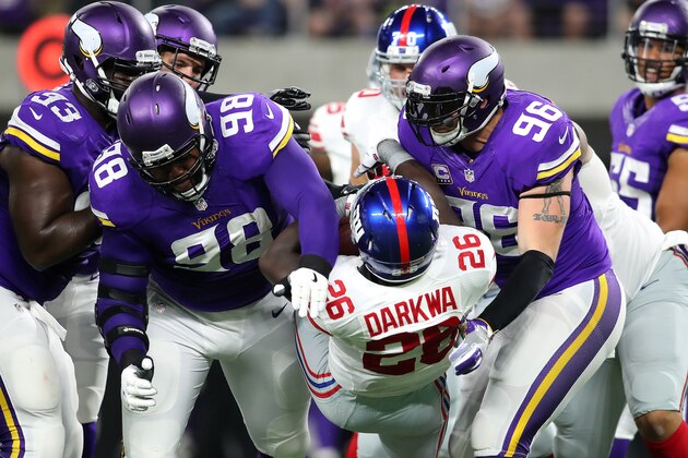 MINNEAPOLIS, MN - OCTOBER 3: Linval Joseph #98 and Brian Robison #96 of the Minnesota Vikings tackle ball carrier Orleans Darkwa #26 of the New York Giants in the first half of the game on October 3, 2016 at US Bank Stadium in Minneapolis, Minnesota. (Photo by Adam Bettcher/Getty Images)